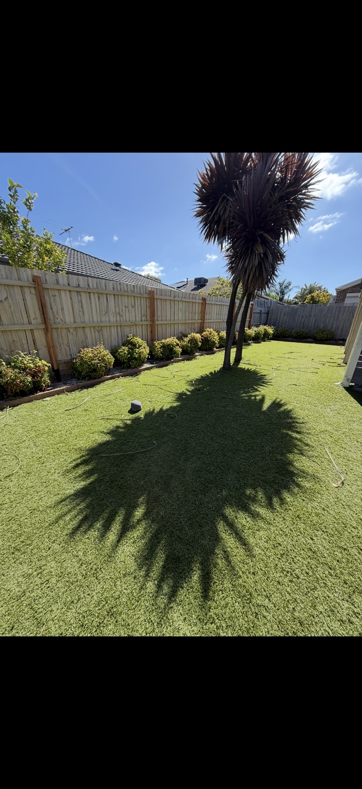 Completed timber fence enclosing a residential garden